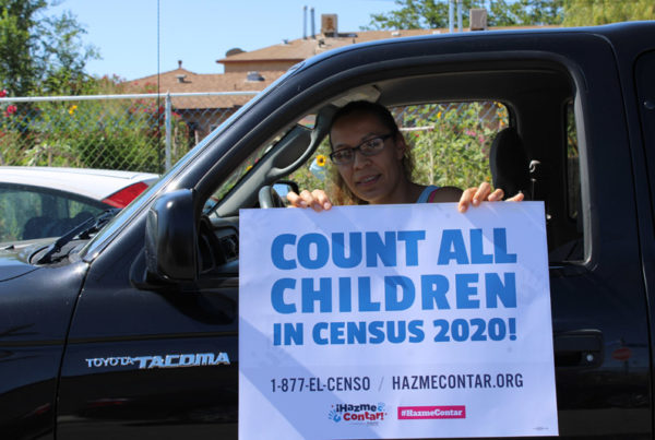 Women holding 2020 census sign